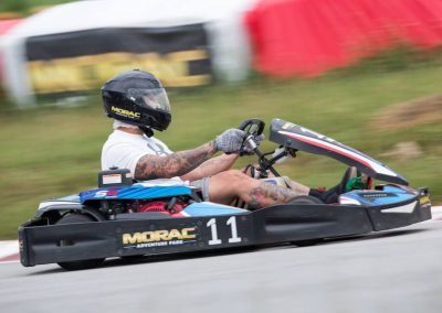go kart racer with tattoos racing around Malaysia's largest and most challenging circuit, Morac Adventure Park, Langkawi, Malaysia