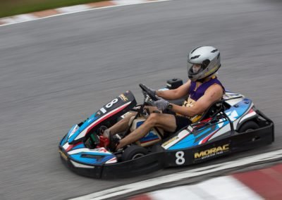 go kart racer wearing a L.A. Lakers singlet racing around Malaysia's largest and most challenging circuit, Morac Adventure Park, Langkawi, Malaysia