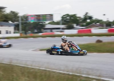 girl go kart racer driving around Malaysia's largest and most challenging circuit, Morac Adventure Park, Langkawi, Malaysia